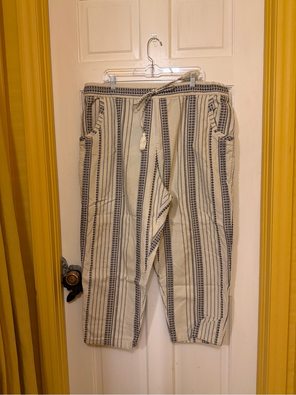 Anthropologie cream and black patterned trousers